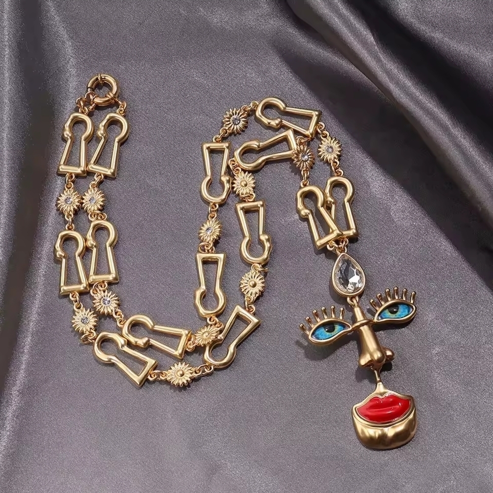 Gold-tone Abstract Face Pendant Necklace with Red Lips - Picture 3 of 5